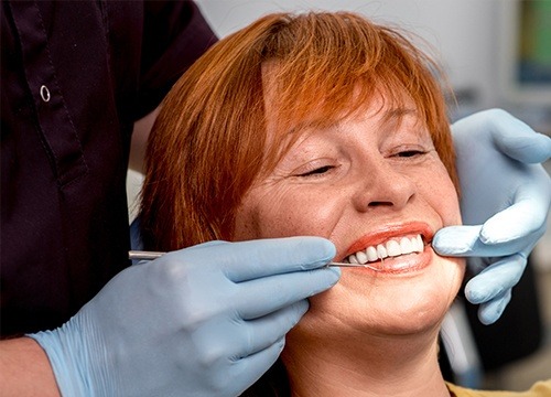 dentist showing woman her smile