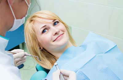 A female patient at the dentist