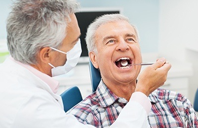 older man getting checkup