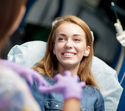 woman smiling in exam chair