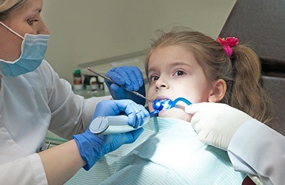 girl getting fluoride treatment