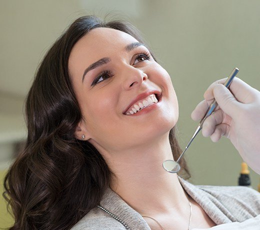 woman in grey smiling