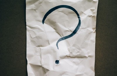 Question mark on wrinkled paper