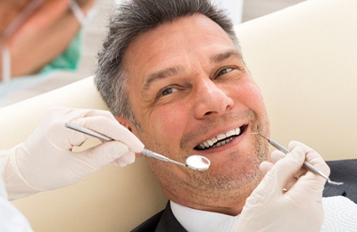 Smiling man in the dental chair