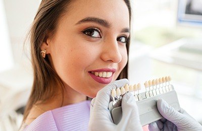 woman smiling by shade chart