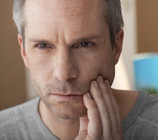 man holding lower jaw