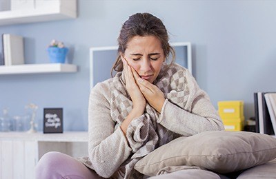 woman in pain on bed