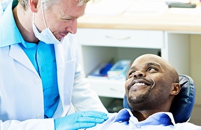 man smiling at dentist