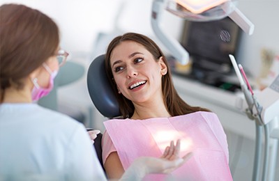 woman talking to dentist