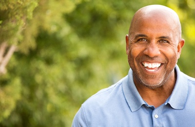 older man bald head smiling