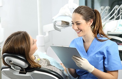 dentist speaking to patient about veneers in Brownstown