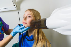 Child receiving dental x-ray