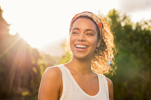 attractive woman smiling at sunset